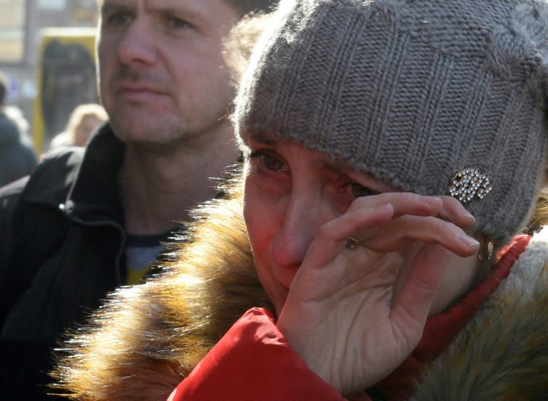 A woman reacts at a memorial site for the victims of the April 3 blast outside Technological Institute metro station in Saint Petersburg