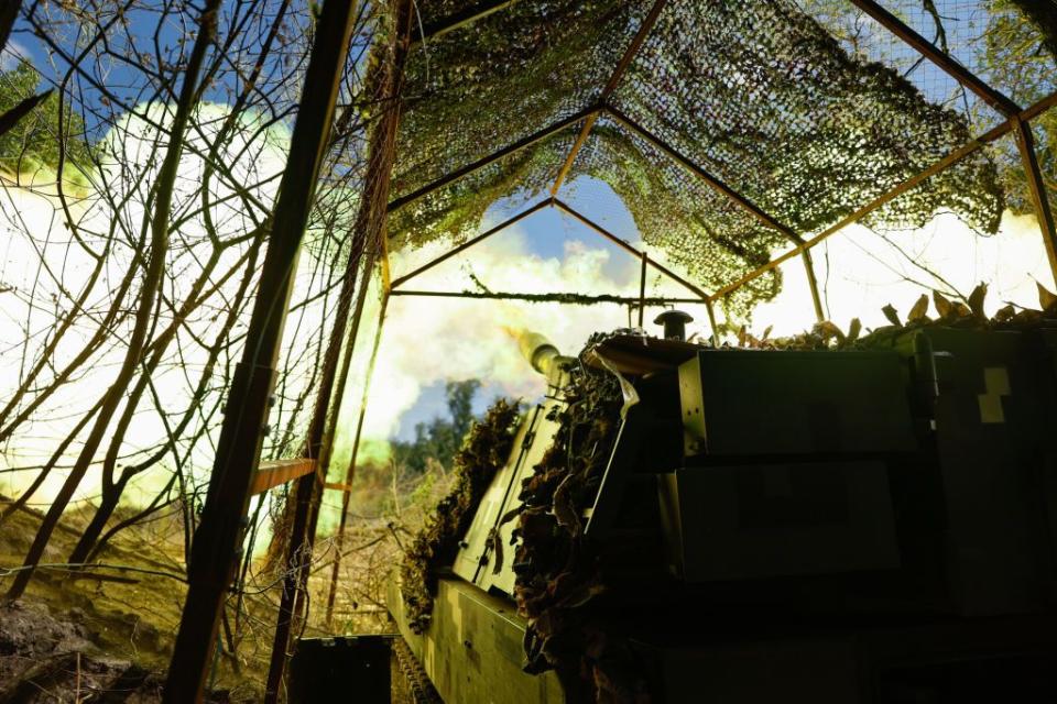 A 155-mm M109 self-propelled howitzer protected by anti-drone netting fires onto Russian positions near the occupied Ukrainian city of Bakhmut on Aug. 17, 2023 in Donetsk Oblast. (Roman Chop/Global Images Ukraine via Getty Images)