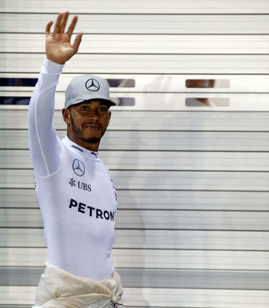 Formula One - Singapore Grand Prix - Marina Bay, Singapore - 17/9/16 Mercedes' driver Lewis Hamilton of Britain celebrates after qualifying session. REUTERS/Edgar Su