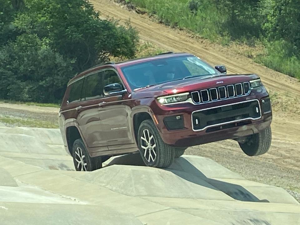 The 2021 Jeep Grand Cherokee L negotiates "camel humps" with 14-inch dips and rises at the Stellantis proving ground in Chelsea, Michigan.