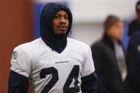 Seattle Seahawks running back Marshawn Lynch stands on sideline at their NFL Super Bowl XLVIII football practice in East Rutherford, New Jersey, January 30, 2014. REUTERS/Shannon Stapleton