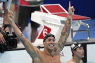 Caeleb Dressel of the United States celebrates winning the men's 100-meter freestyle final at the 2020 Summer Olympics, Thursday, July 29, 2021, in Tokyo, Japan. (AP Photo/Matthias Schrader)