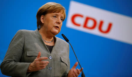 German Chancellor Angela Merkel gives a statement at the CDU headquarters in Berlin, Germany, January 21, 2017, after Germany's Social Democrats (SPD) voted to begin formal coalition talks with Chancellor Merkel's conservatives. REUTERS/Axel Schmidt