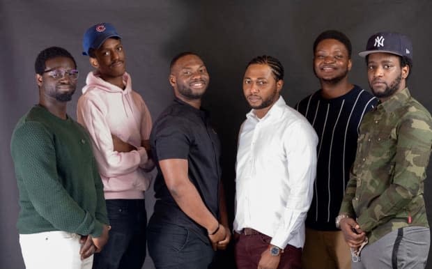 Tomi Okunnuga, second from right, stands with his crew from Orchard Lane Media. Together, they created a series showcasing lesser known eateries in Edmonton. (Tomi Okunnuga/YEG Eats - image credit)