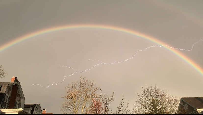 A lightning bolt is seen intersecting with a double rainbow in Columbus (NBC4 Photo/Adam Conn)