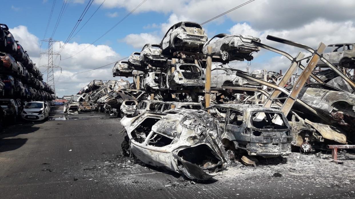 Burnt out vehicles on car lot in Carcroft in Doncaster: PA