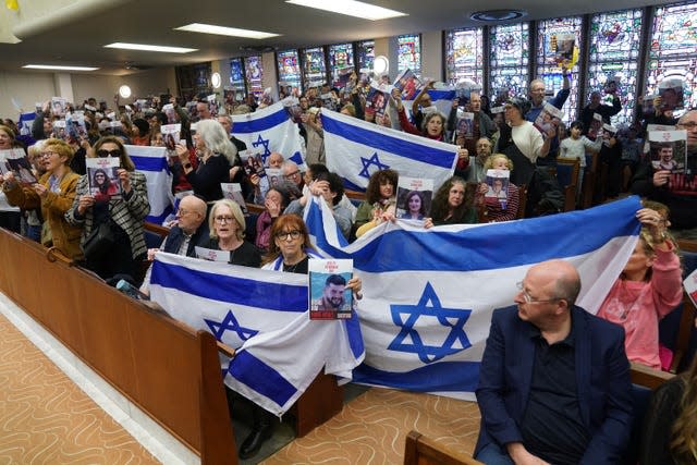 Families of hostages taken in the October 7 Hamas attacks take part in a rally to call for their release at St Johns Wood United Synagogue in London.