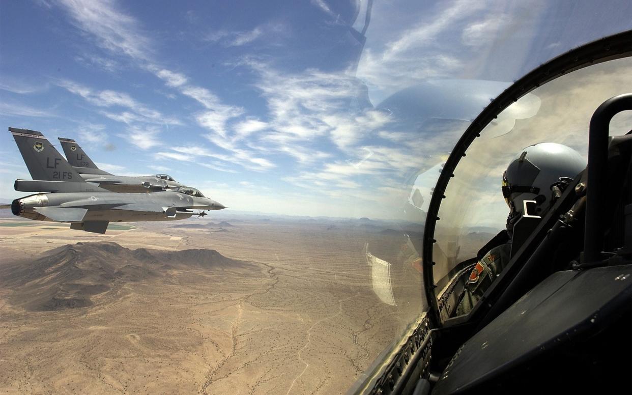 F-16 fighters fly in formation over Arizona