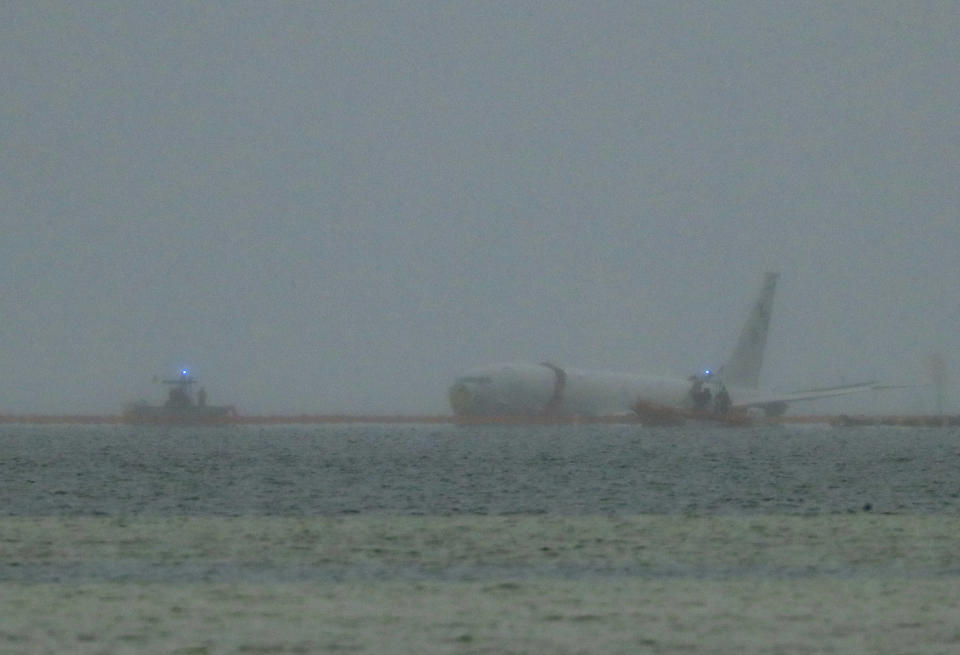 A downed U.S. Navy aircraft is seen in Kaneohe Bay, Monday, Nov. 20, 2023, in Kaneohe, Hawaii. (Jamm Aquino/Honolulu Star-Advertiser via AP)