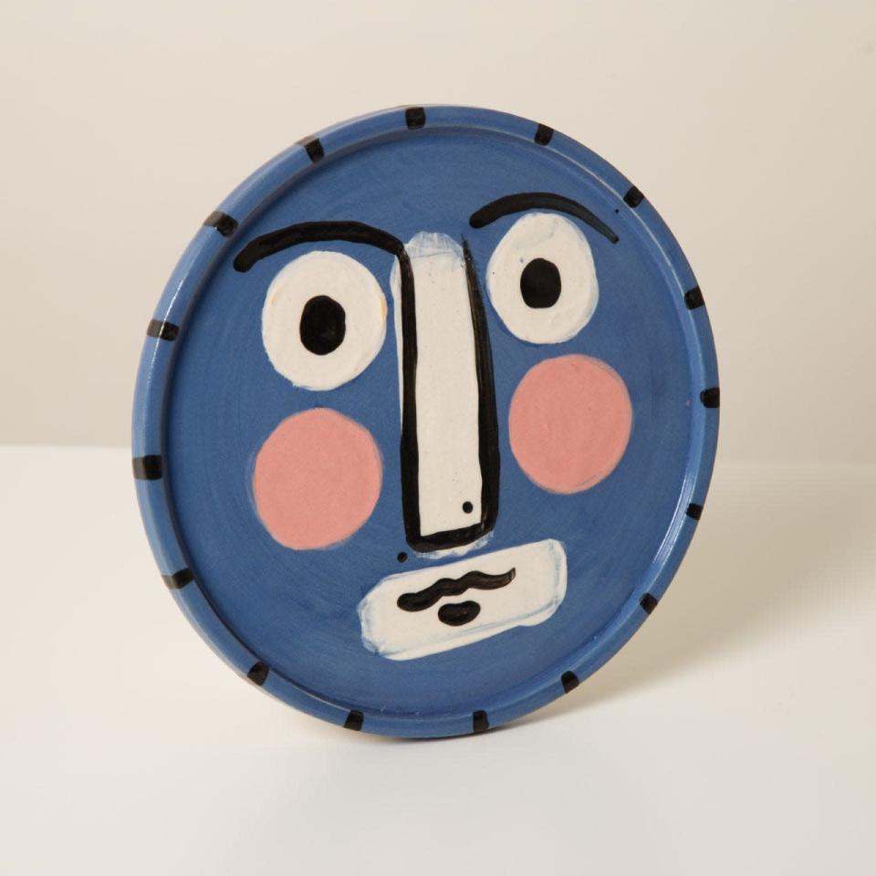 <p>This friendly face is made from Staffordshire white stoneware and is hand thrown and painted by Kate Sellers in her studio in Kent. Each plate is unique and can be used for dining as well as displayed on the wall. £75, <a href="https://crouchers.com/products/hand-thrown-face-plate?_pos=4&_sid=fa149b74d&_ss=r" rel="nofollow noopener" target="_blank" data-ylk="slk:crouchers.com" class="link ">crouchers.com</a></p>