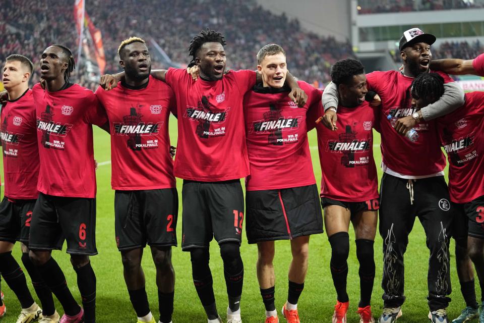Leverkusen players celebrate after the German soccer cup match between Bayer 04 Leverkusen and Fortuna Duesseldorf in Leverkusen, Germany, April 3, 2024. (AP Photo/Martin Meissner)