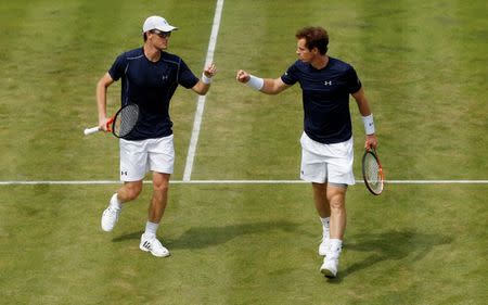 Tennis - Great Britain v France - Davis Cup World Group Quarter Final - Queen’s Club, London - 18/7/15 Great Britain's Jamie Murray and Andy Murray celebrate between points during their doubles match Action Images via Reuters / Andrew Boyers Livepic
