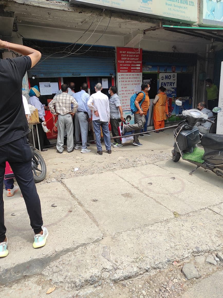 No social distancing visible outside a shop in Mandi.