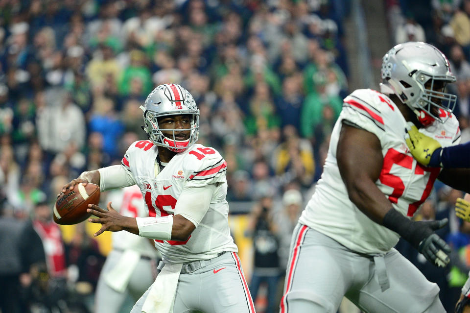 Quarterback J.T. Barrett #16 of the Ohio State Buckeyes throws a pass during the first quarter of the BattleFrog Fiesta Bowl against the <a class="link " href="https://sports.yahoo.com/ncaaw/teams/notre-dame/" data-i13n="sec:content-canvas;subsec:anchor_text;elm:context_link" data-ylk="slk:Notre Dame Fighting Irish;sec:content-canvas;subsec:anchor_text;elm:context_link;itc:0">Notre Dame Fighting Irish</a> at University of Phoenix Stadium on Jan. 1, 2016, in Glendale, Arizona. Jennifer Stewart/Getty Images