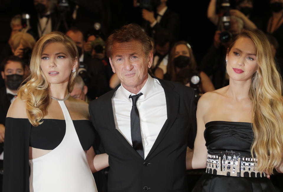 Katheryn Winnick, from left, Sean Penn, and Dylan Penn pose for photographers upon arrival at the premiere of the film 'Flag Day' at the 74th international film festival, Cannes, southern France, Saturday, July 10, 2021. (Photo by Vianney Le Caer/Invision/AP)