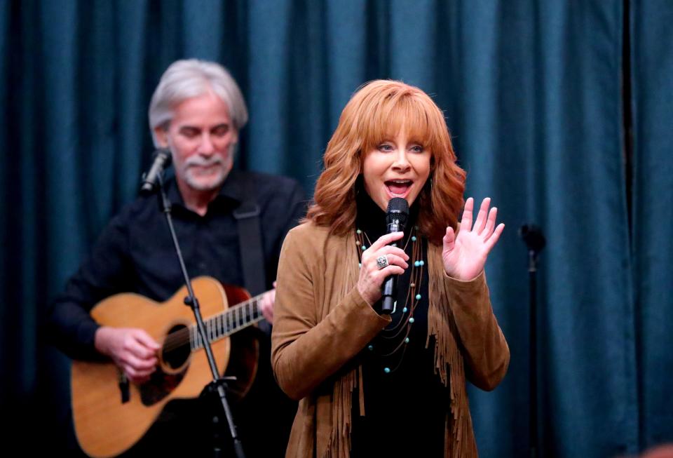 Reba McEntire performs Thursday during the grand opening of her new restaurant in Atoka, Reba's Place.