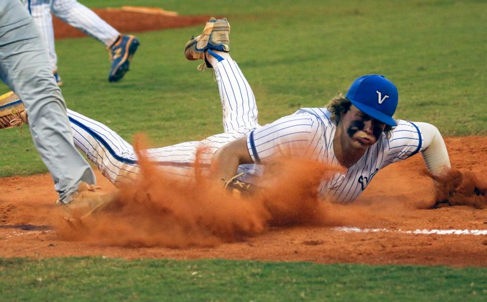 Lakeland Christian first baseman Ben McDonald dives to tag first base ahead of the runner for the final out of the inning in the Vikings' 3-1 victory over Winter Haven on Tuesday night in the Gold Division championship game of the 2022 Polk County Championships. McDonald also homered earlier in the game.