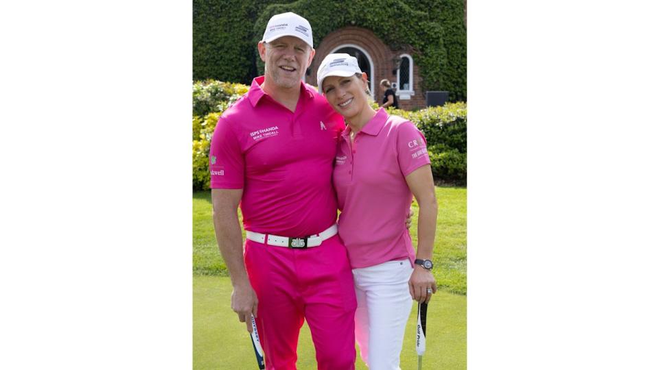 Mike and Zara Tindall, wearing pink, pose at ISPS Handa Mike Tindall Celebrity Golf  Classic  at the Belfry Golf Course.