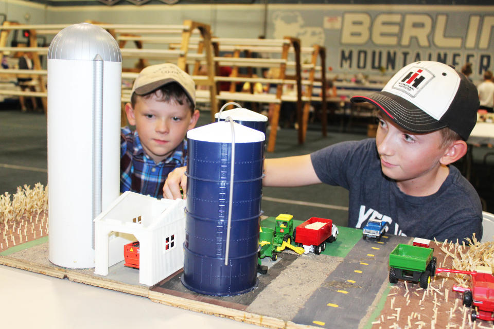 Brothers Gavin and Garret Waydo, sons of Brian and Stephanie Waydo of Fairview Road in Berlin, each created a miniature farm display for this year's Berlin Fair. They're putting some finishing touches on their designs before entry on Wednesday.
