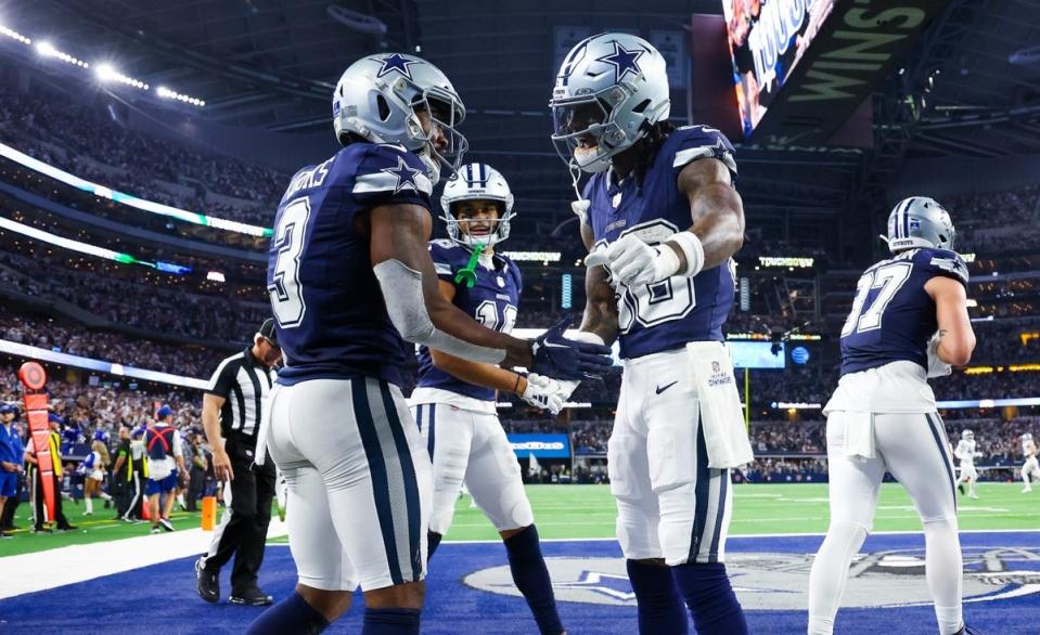 Dec 30, 2023; Arlington, Texas, USA; Dallas Cowboys wide receiver Brandin Cooks (3) celebrates with Dallas Cowboys wide receiver CeeDee Lamb (88) after making a touchdown catch during the second half against the Detroit Lions at AT&T Stadium. Mandatory Credit: Kevin Jairaj-USA TODAY Sports