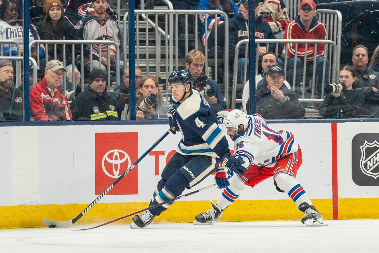 Oct 14, 2023; Columbus, Ohio, United States;
Columbus Blue Jackets center Cole Sillinger (4) fights for the puck against New York Rangers center Vincent Trocheck (16) during the third period their game on Saturday, Oct. 14, 2023 at Nationwide Arena.