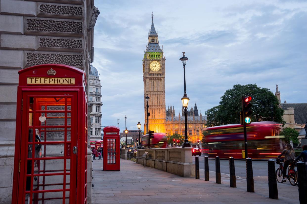 Big Ben and Westminster Abbey With Red Telephone Booths in London