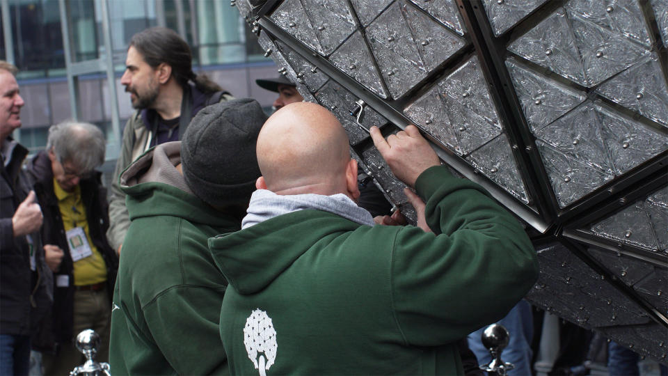 Landmark Signs & Electric workers installing a new panel with new crystal triangles for this year's New Year's Eve Ball.