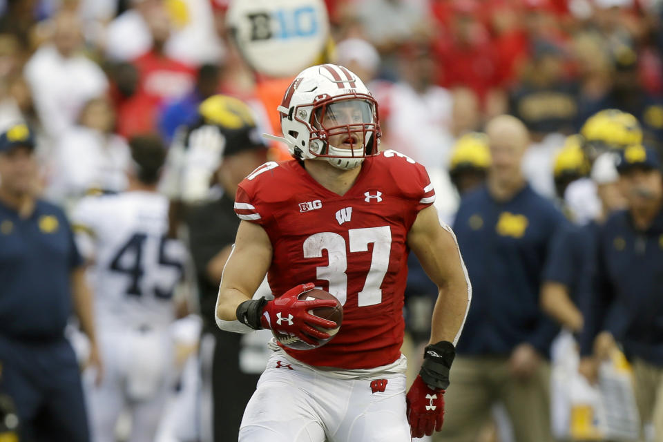 FILE - In this Sept. 21, 2019, file photo, Wisconsin running back Garrett Groshek (37) carries during the second half of an NCAA college football game against Michigan, in Madison, Wis. Wisconsin’s rushing attack will look quite a bit different this season without Jonathan Taylor in the backfield. Wisconsin begins adjusting to life without Taylor on Friday night, Oct. 23, 2020, when the 14th-ranked Badgers host Illinois in their pandemic-delayed season opener. (AP Photo/Andy Manis, File)