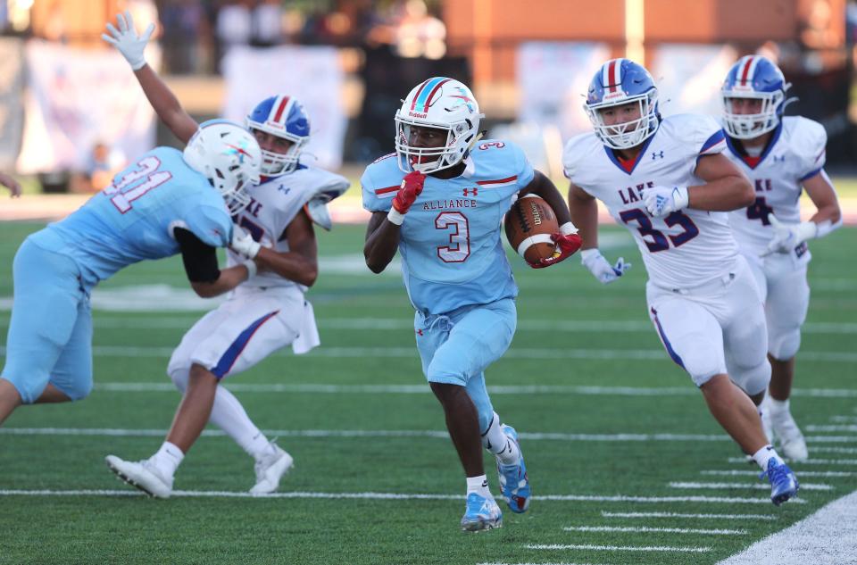 Alliance's Ramhir Hawkins (3) takes off down the sideline during a high school football game vs. Lake at Kehres Stadium on Friday, August 19, 2022.