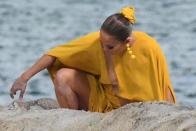 J.Lo was seen dipping her toes into the soft sand during the video shoot.