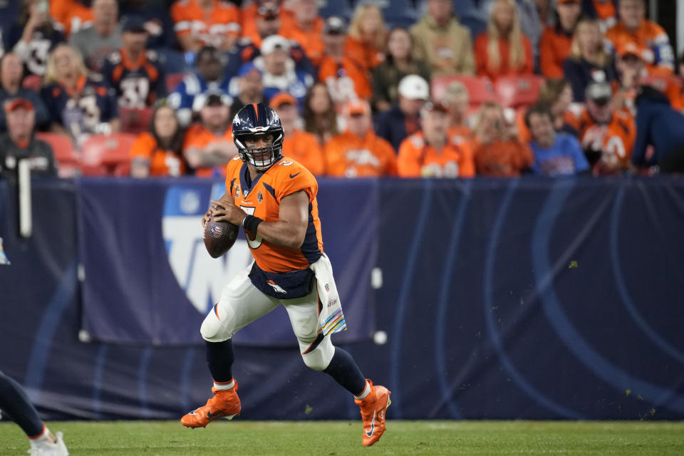 Denver Broncos quarterback Russell Wilson (3) looks to pass against the Indianapolis Colts during the second half of an NFL football game, Thursday, Oct. 6, 2022, in Denver. (AP Photo/David Zalubowski)