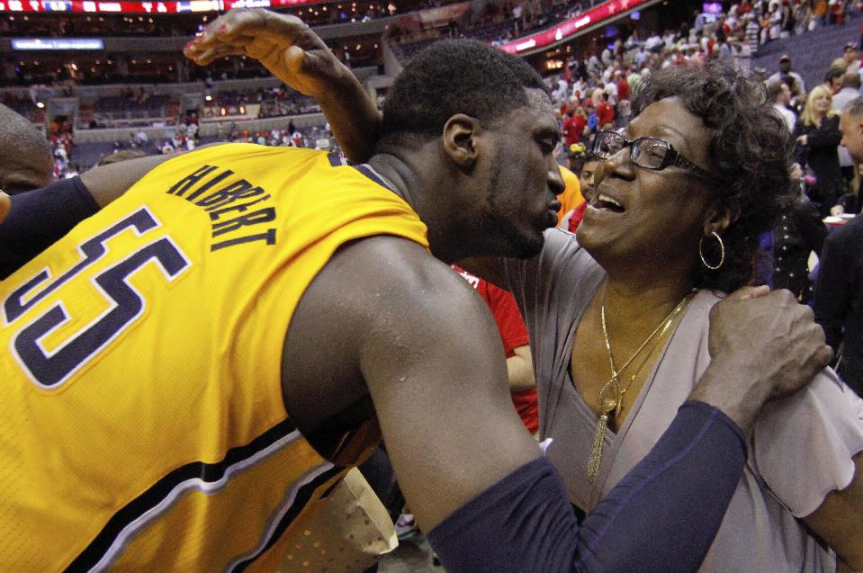 Indiana Pacers center Roy Hibbert (55) kisses his mother Patricia Hibbert after Game 4 of an Eastern Conference semifinal NBA basketball playoff game in Washington, Sunday, May 11, 2014. The Pacers won 95-92. (AP Photo/Alex Brandon)