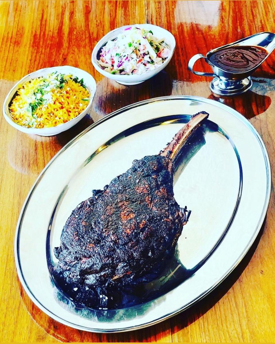 The bison tomahawk ribeye at Craft Taqueria in New City is a 32-ounce steak from Fossil Farms. It features an ancho chile rub and is served with rice, Mexican coleslaw, and housemade coffee-chipotle barbecue sauce.