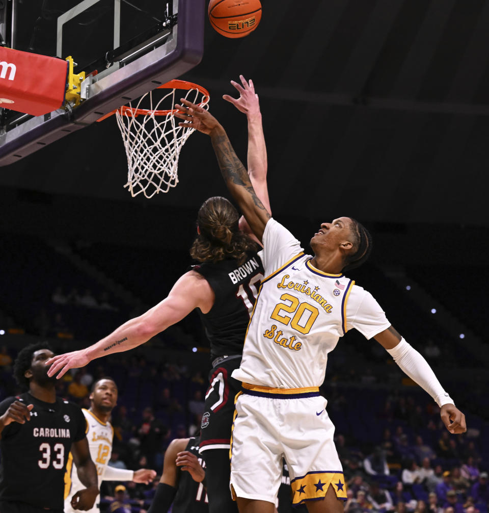 LSU forward Derek Fountain (20) and South Carolina forward Hayden Brown (10) go up for the rebound during an NCAA college basketball game, Saturday, Feb. 18, 2023, in Baton Rouge, La. (Hilary Scheinuk/The Advocate via AP)