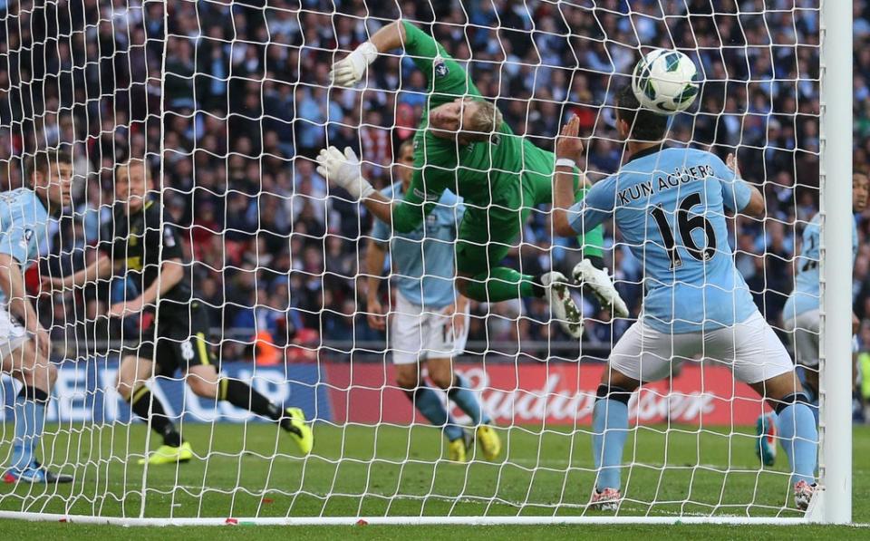 Wigan’s Ben Watson (second left) heads home the wining goal against Manchester City Dave Thompson/PA) (PA Archive)