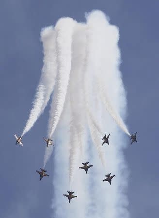 South Korea's Black Eagles aerobatics team perform a maneuver during a preview of the Singapore Airshow at Changi exhibition center in Singapore February 14, 2016. REUTERS/Edgar Su