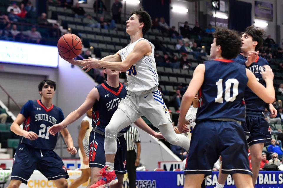 Irondequoit's Quinn VanKerkhove drives to the basket against South Side during a NYSPHSAA Class A Boys Basketball Championship semifinal in Glens Falls, N.Y., Friday, March 17, 2023. Irondequoit advanced to the Class A final with a 50-29 win over South Side-VIII.