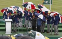 U.S. team member Zach Johnson (2nd R) holds up the Presidents Cup as other team members clap their hands to celebrate their victory over International team during a ceremony after the singles matches of the 2015 Presidents Cup golf tournament at the Jack Nicklaus Golf Club in Incheon, South Korea, October 11, 2015. REUTERS/Toru Hanai