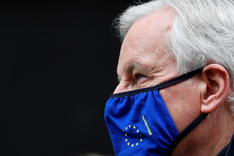 European Union's chief Brexit negotiator Michel Barnier wearing a face mask walks to Brexit trade negotiations in London