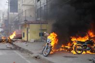 Police motorcycles burn after being set on fire during demonstrations against India's new citizenship law in Lucknow on December 19, 2019. - Indians defied bans on assembly on December 19 in cities nationwide as anger swells against a citizenship law seen as discriminatory against Muslims, following days of protests, clashes and riots that have left six dead. (Photo by STR / AFP) (Photo by STR/AFP via Getty Images)