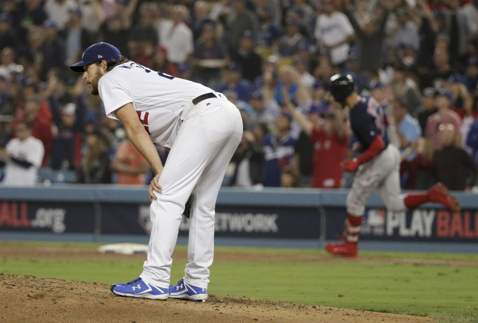 Los Angeles.Boston Red Sox's Mookie Betts, right, watches his home run off Los Angeles Dodgers starting pitcher Clayton Kershaw during the sixth inning in Game 5 of the World Series baseball game on Sunday, Oct. 28, 2018, in Los Angeles. (AP Photo/Jae C. Hong)