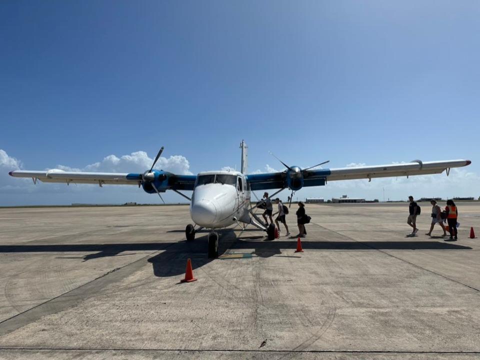 boarding a charter on runway canouan freelancer photo