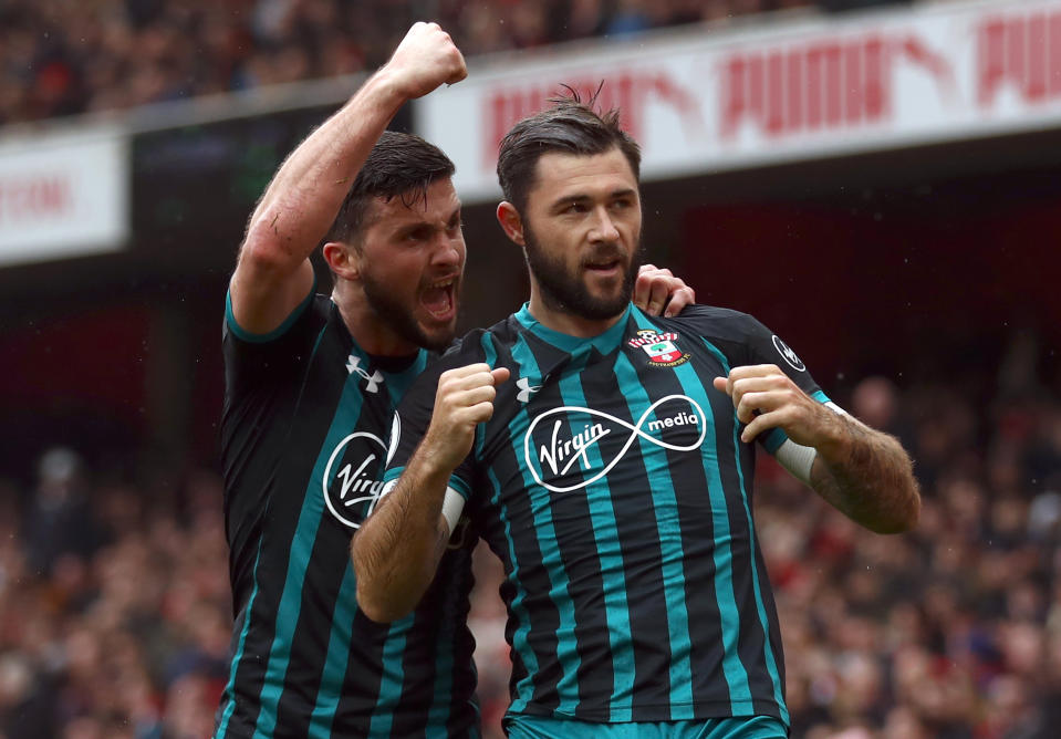 Shane Long and Charlie Austin celebrate after Southampton score at Arsenal