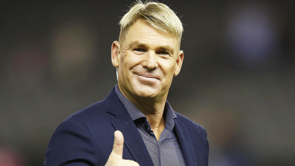 Shane Warne, pictured during a Big Bash League game, has revealed why he won't be able to make it to the Bushfire Bash in Melbourne this Sunday.