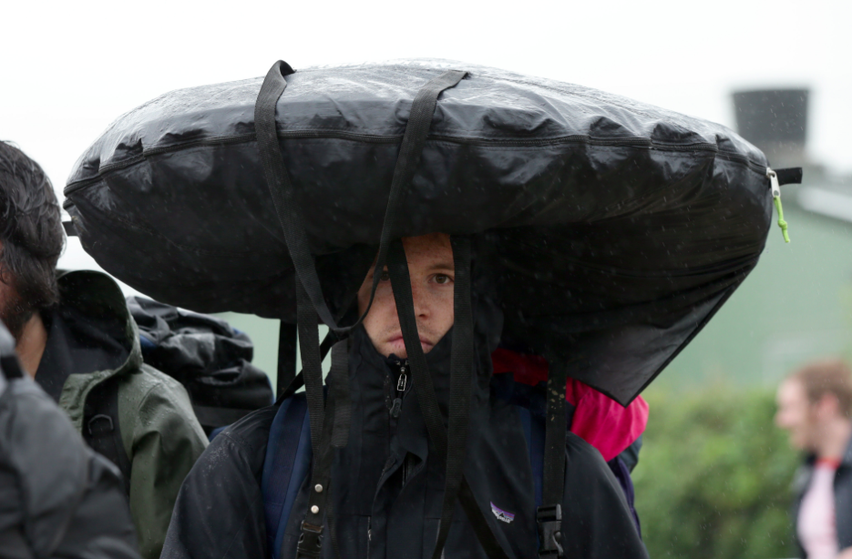 When your luggage becomes your umbrella. (PA)