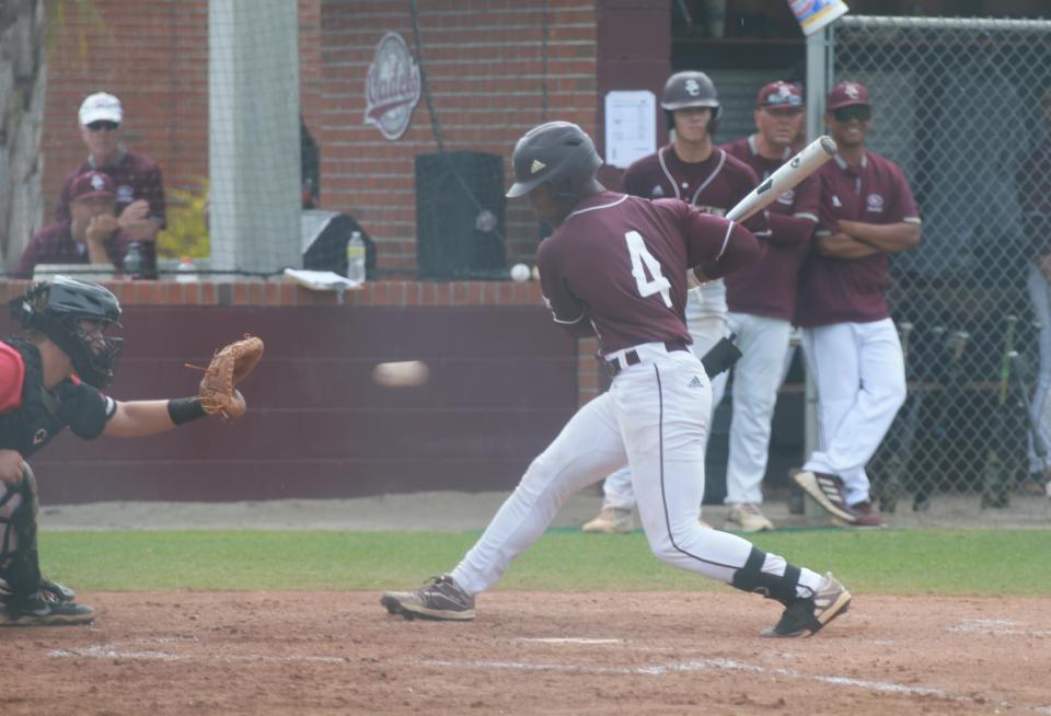 Benedictine's Justin Thomas avoids an inside pitch during the first game of Saturday's state semifinal playoff series against North Oconee.