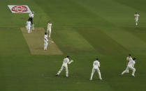 England's James Anderson, fourth left, celebrates the dismissal of Pakistan's captain Azhar Ali, third left, during the first day of the second cricket Test match between England and Pakistan, at the Ageas Bowl in Southampton, England, Thursday, Aug. 13, 2020. (Stu Forster/Pool via AP)