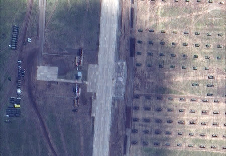 A satellite image of tanks and armored vehicles staging during the Russian military exercise known as Vostok 2018, conducted at the Tsugol training area in eastern Russia, September 13, 2018. Satellite image ©2018 DigitalGlobe, a Maxar company/Handout via REUTERS