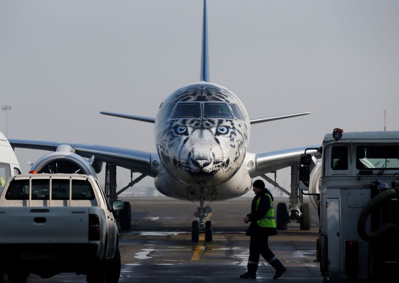 FILE PHOTO: Air Astana Embraer E190-E2 aircraft with a snow leopard livery is seen at Almaty International Airport