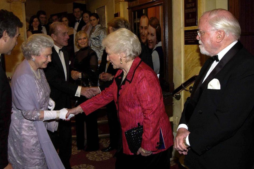 Queen Elizabeth II meets Katie Boyle, whose husband Peter was the first producer of The Mousetrap at the show’s 50th anniversary in 2002 (PA)